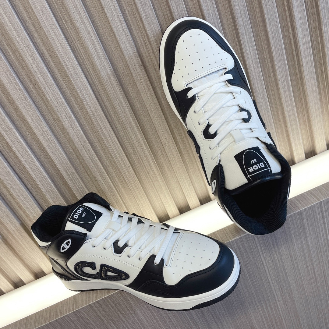 ua D*or b57 mid-top sneaker black and white
